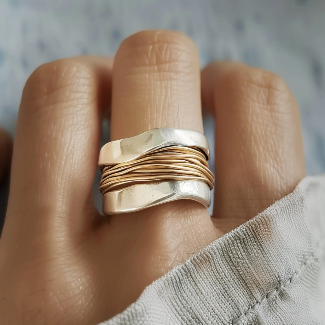 Silver ring with gold threads