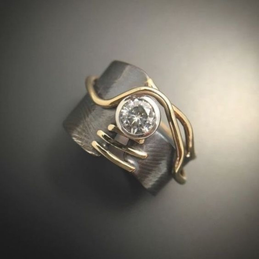 Dark ring with vintage zircon