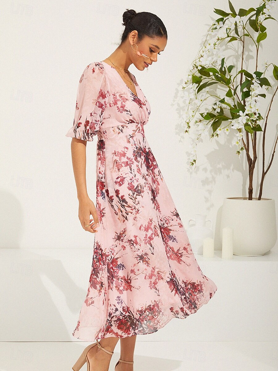 Robe en mousseline de soie rose à fleurs et manches bouffantes